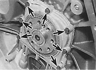 Location of the crankshaft rear cover mounting bolts on a 4-cylinder petrol engine