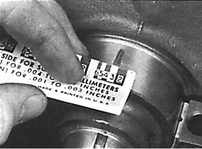 Measuring the width of a deformed Plastigage rod using a scale ruler