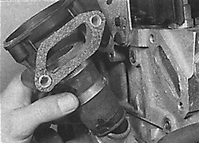 Disconnecting the bypass hose and removing the thermostat housing