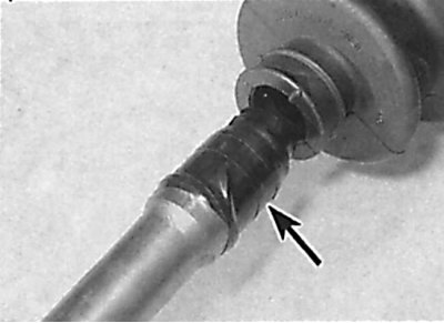 Installing a new inner CV joint protective boot on the drive shaft