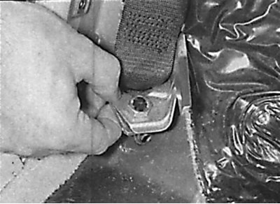 Removal the lower rear seat belt anchor
