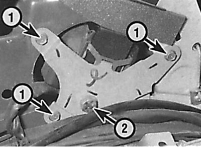 Location of the inertia drum bracket mounting bolts (1) and the inertia drum to bracket mounting…