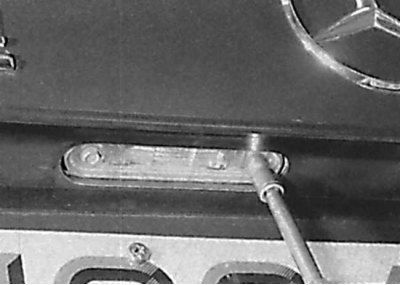 Unscrewing the screw securing the license plate light