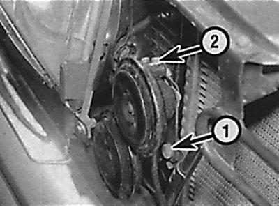 Location of the mounting bolt (1) and electrical connector (2) of the horn