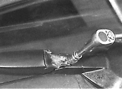 Unscrewing the windshield wiper arm