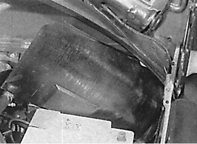 Removal the plastic insulating panel located behind the battery