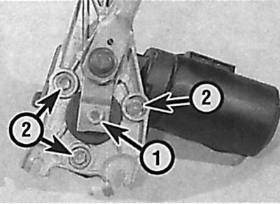 Location of the nut on the crank shaft (1) and the windshield wiper motor mounting bolts