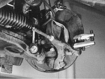 Fig. 7.16. Using a puller, press the ball joint pin out of the steering arm