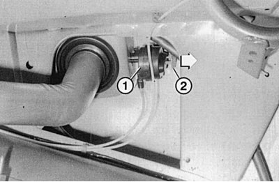 Fig. 10.9. You can gain access to the locking mechanism (1) of the fuel filler flap by removing the…
