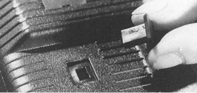 Fig. 11.20. To remove the trunk trim, carefully remove the sliding tabs by inserting a screwdriver…