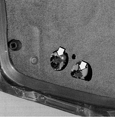 Fig. 9.25. To replace a faulty reversing light bulb or rear fog lights, turn the socket (arrows)…