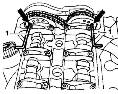 3. Insert 4 mm diameter rods into the holes of the camshaft sprockets (arrows) of the right and…