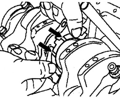 3. Install the end play adjusters. The oil passages should be lubricated and installed forward.
