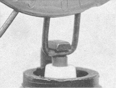 Note: When adjusting the gap of a new spark plug, bend only the base of the ground electrode, not…