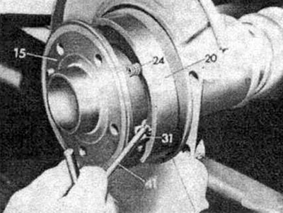 Remove the other spring in the same way.